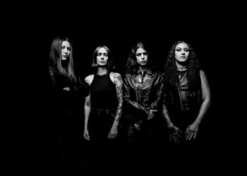 Black-and-white promo photo of Brazilian death metal band Crypta, four members in black leather posing against a dark background.