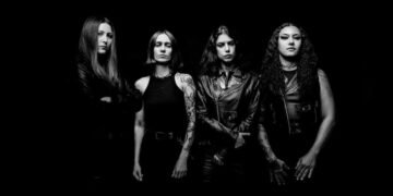 Black-and-white promo photo of Brazilian death metal band Crypta, four members in black leather posing against a dark background.