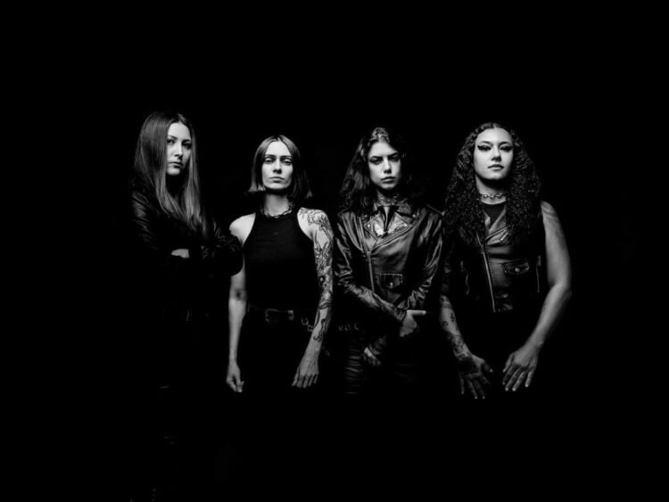 Black-and-white promo photo of Brazilian death metal band Crypta, four members in black leather posing against a dark background.