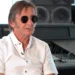 Phil Rudd in sunglasses and a white shirt during an interview in a recording studio